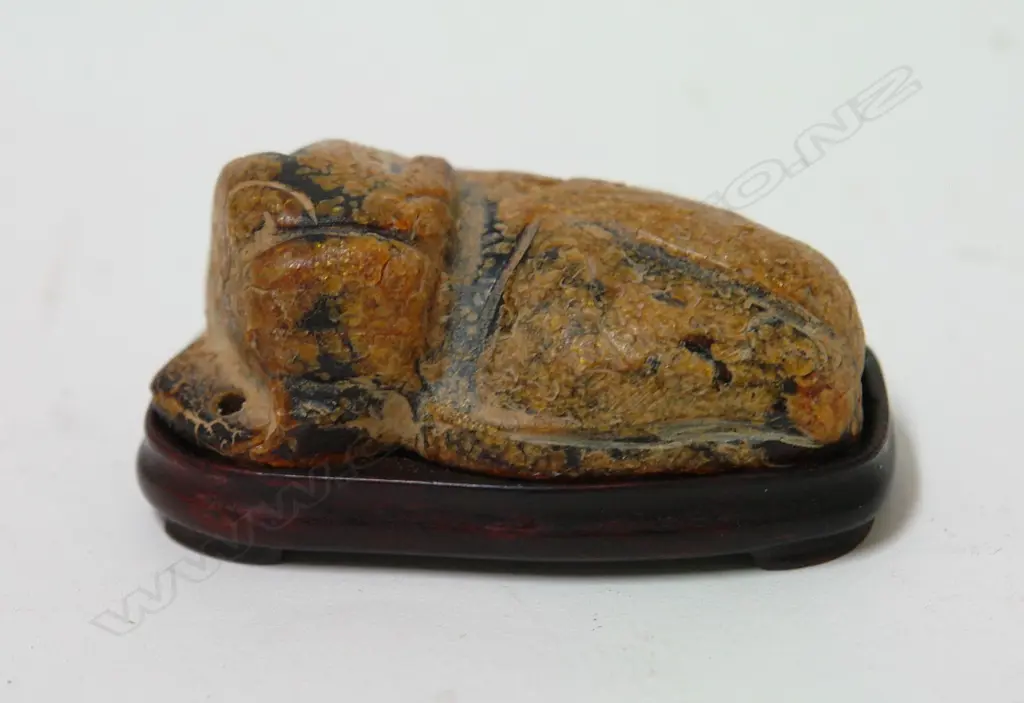 An old Chinese gilded amber carving of a shishi Image 1++