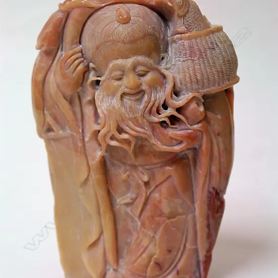 A Chinese Shoushan carved boulder as Shou Lao with long facial hair