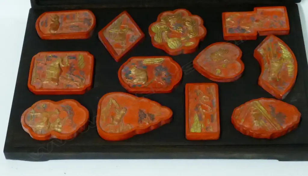 A rosewood boxed set of 12 red ink sticks Image 1++