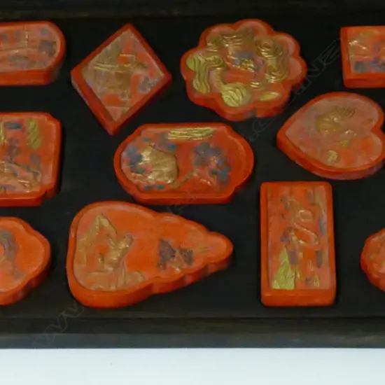 A rosewood boxed set of 12 red ink sticks