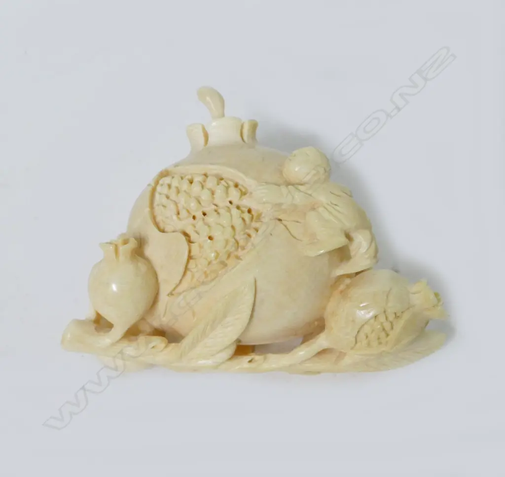 An ivory snuff bottle modelled as a giant pomegranate Image 1++