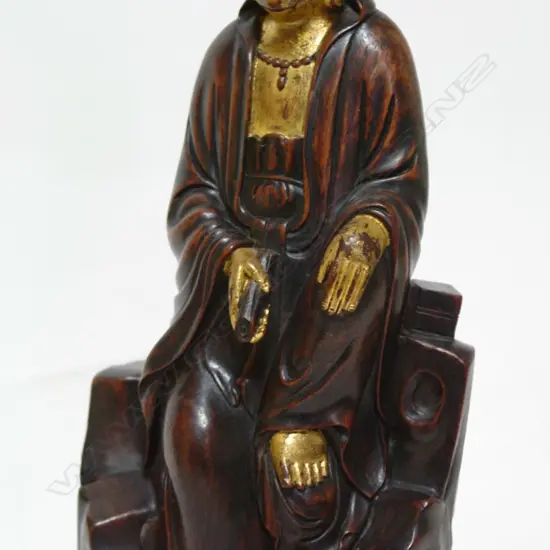 An old Chinese carved hardwood figure of Kuanyin
