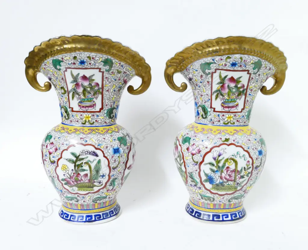 A pair of Chinese porcelain Canton enamel decorated vases Image 1++