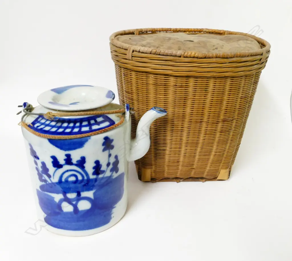 An early 1900s Chinese tea kettle in basket Image 1++