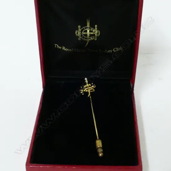 An 18ct. gold Royal Hong Kong Jockey club tie slide