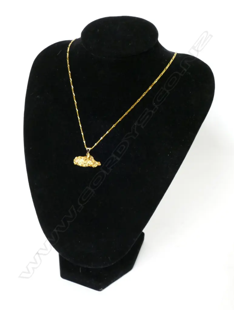 A gold nugget pendant Image 1++