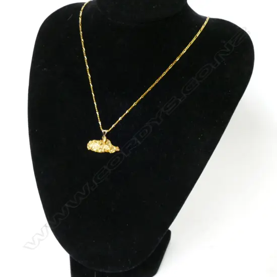 A gold nugget pendant