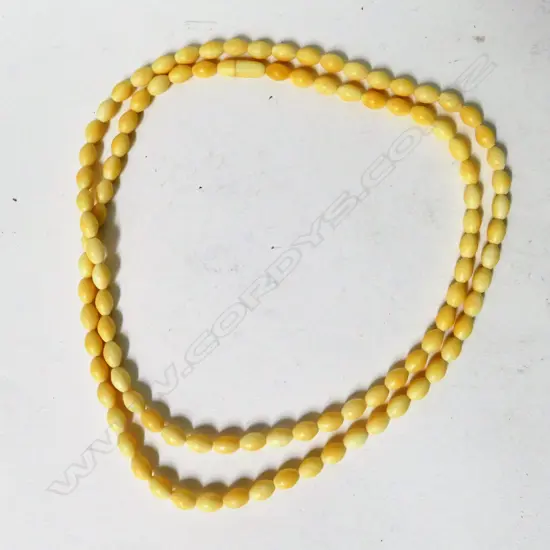 A vintage ivory bead necklace