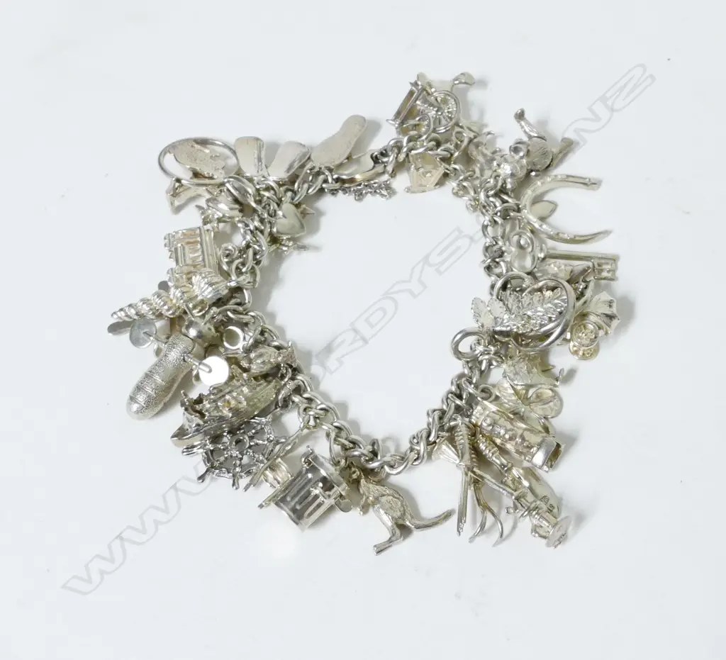 A silver charm bracelet Image 1++