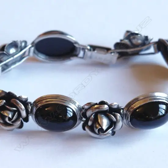 A silver and onyx bracelet