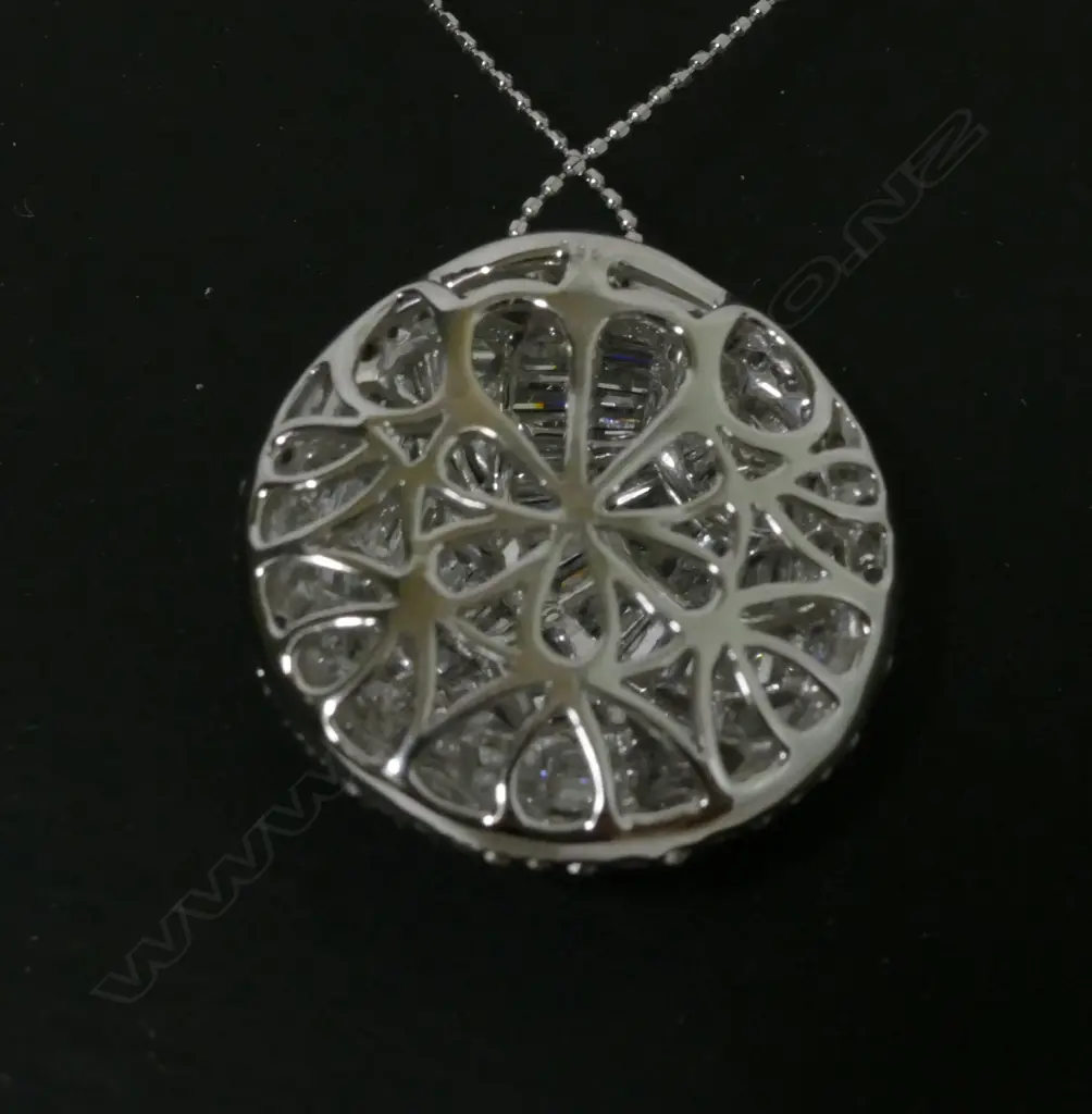 A modern 18ct. white gold and diamond set pendant on chain Image 1++