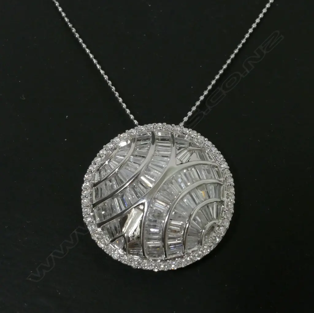 A modern 18ct. white gold and diamond set pendant on chain Image 1++