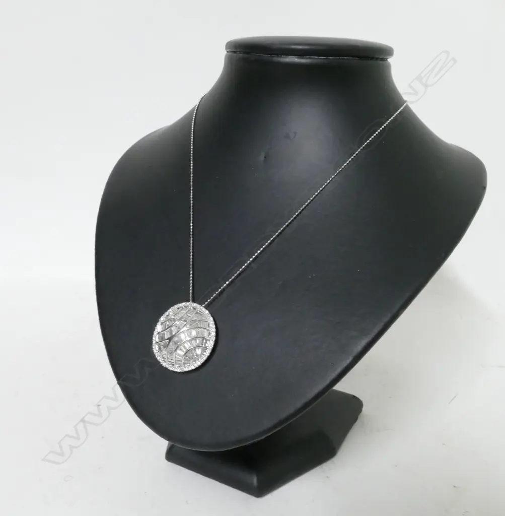 A modern 18ct. white gold and diamond set pendant on chain Image 1++