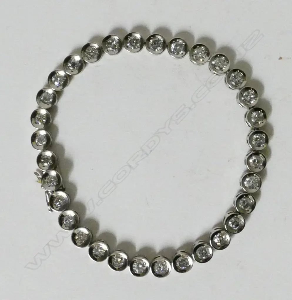 A lady's platinum and diamond tennis bracelet Image 1++