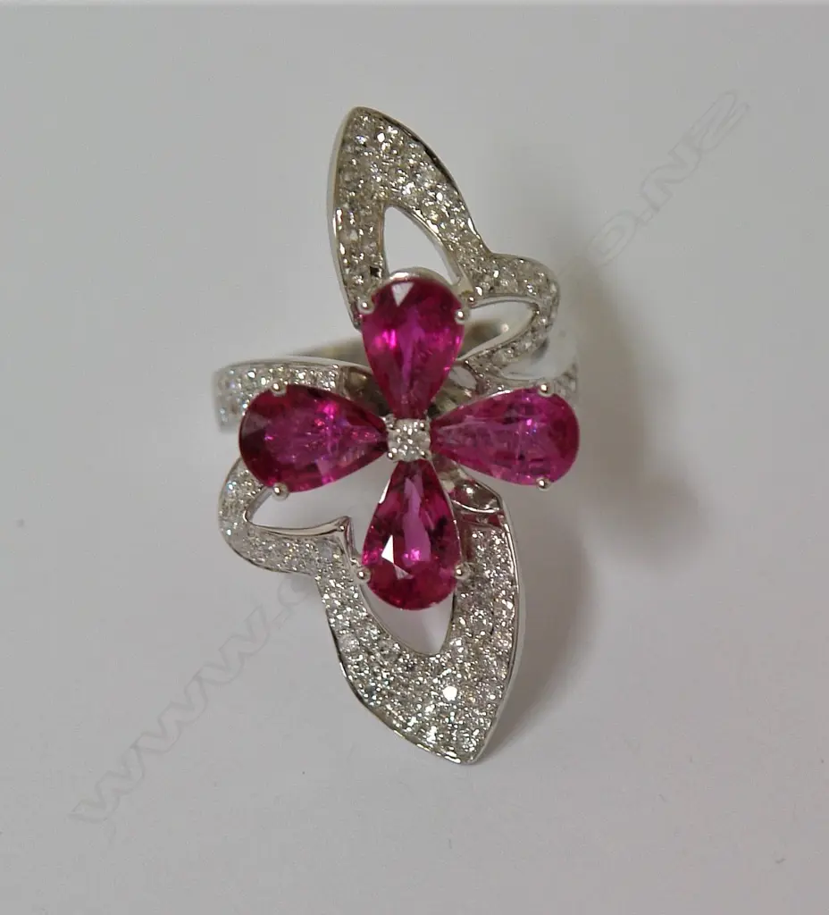 A modern lady's 18ct. gold rubellite and diamond cocktail ring Image 1++