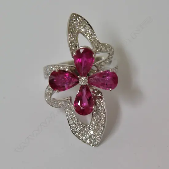 A modern lady's 18ct. gold rubellite and diamond cocktail ring