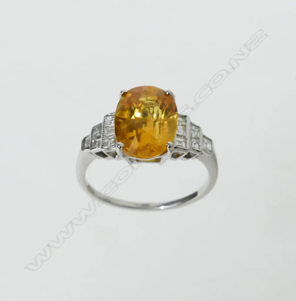 An 18ct white gold yellow sapphire and diamond ring Image 1++