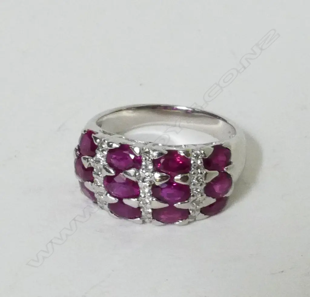 A modern lady's platinum ruby and diamond cluster ring Image 1++
