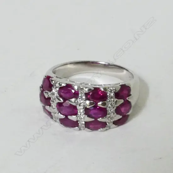 A modern lady's platinum ruby and diamond cluster ring
