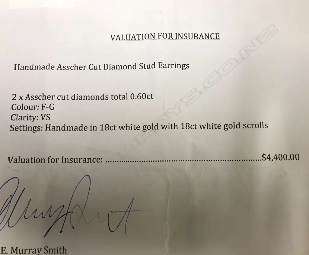 A pair of 18ct. white gold and diamond stud earrings Image 1++