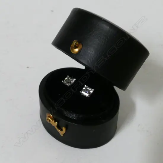 A pair of 18ct. white gold and diamond stud earrings