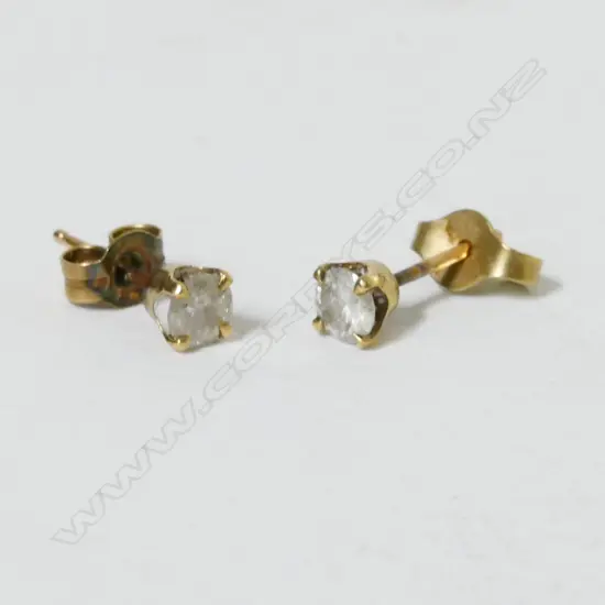 A pair of 9ct gold and diamond stud earrings