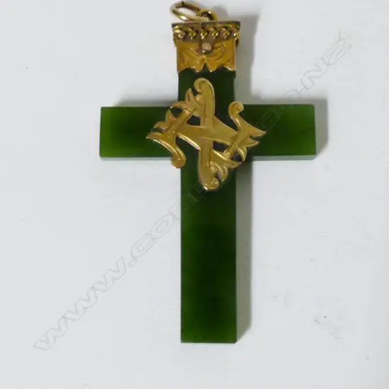 A Colonial 9ct. gold and greenstone cross
