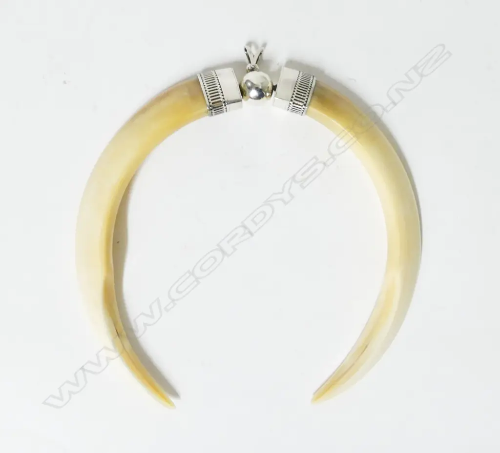 A contemporary large silver and tusk pendant Image 1++