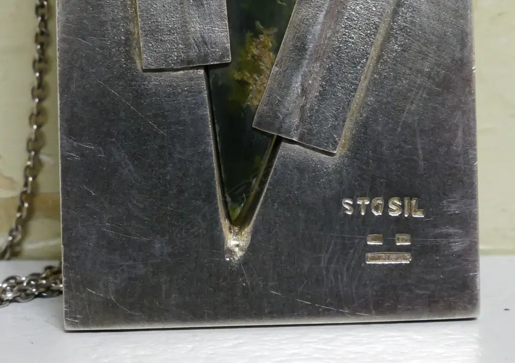 A contemporary silver and 'Marsden flower' pounamu pendant Image 1++