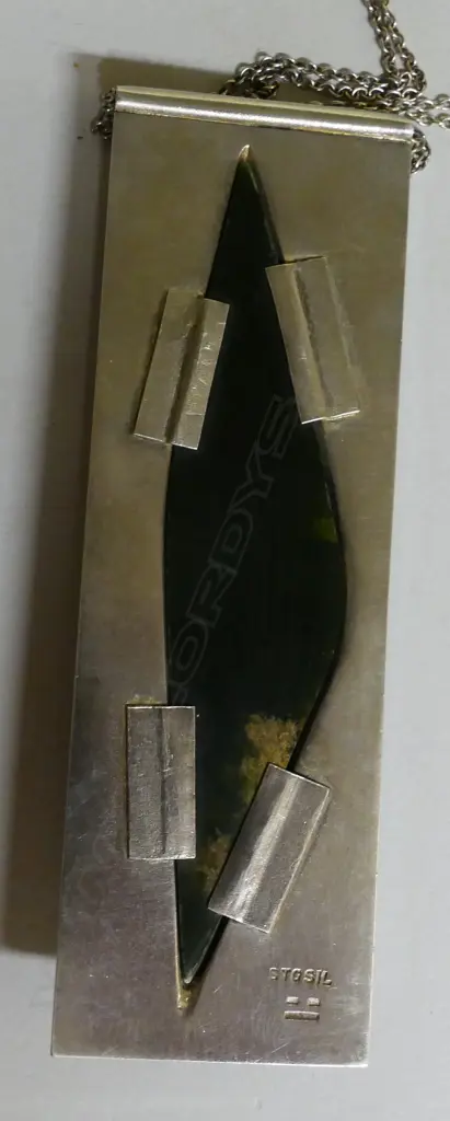 A contemporary silver and 'Marsden flower' pounamu pendant Image 1++