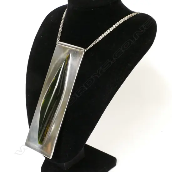 A contemporary silver and 'Marsden flower' pounamu pendant