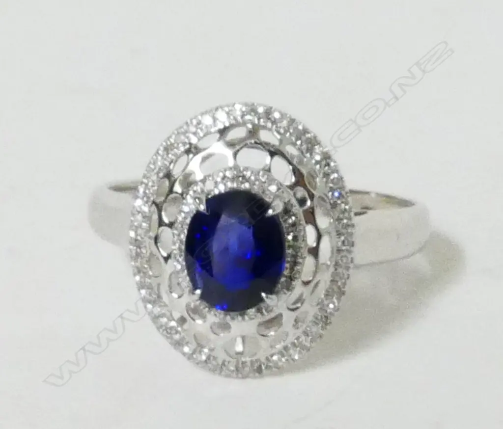 A lady's modern 18ct. white gold sapphire and diamond dress ring Image 1++