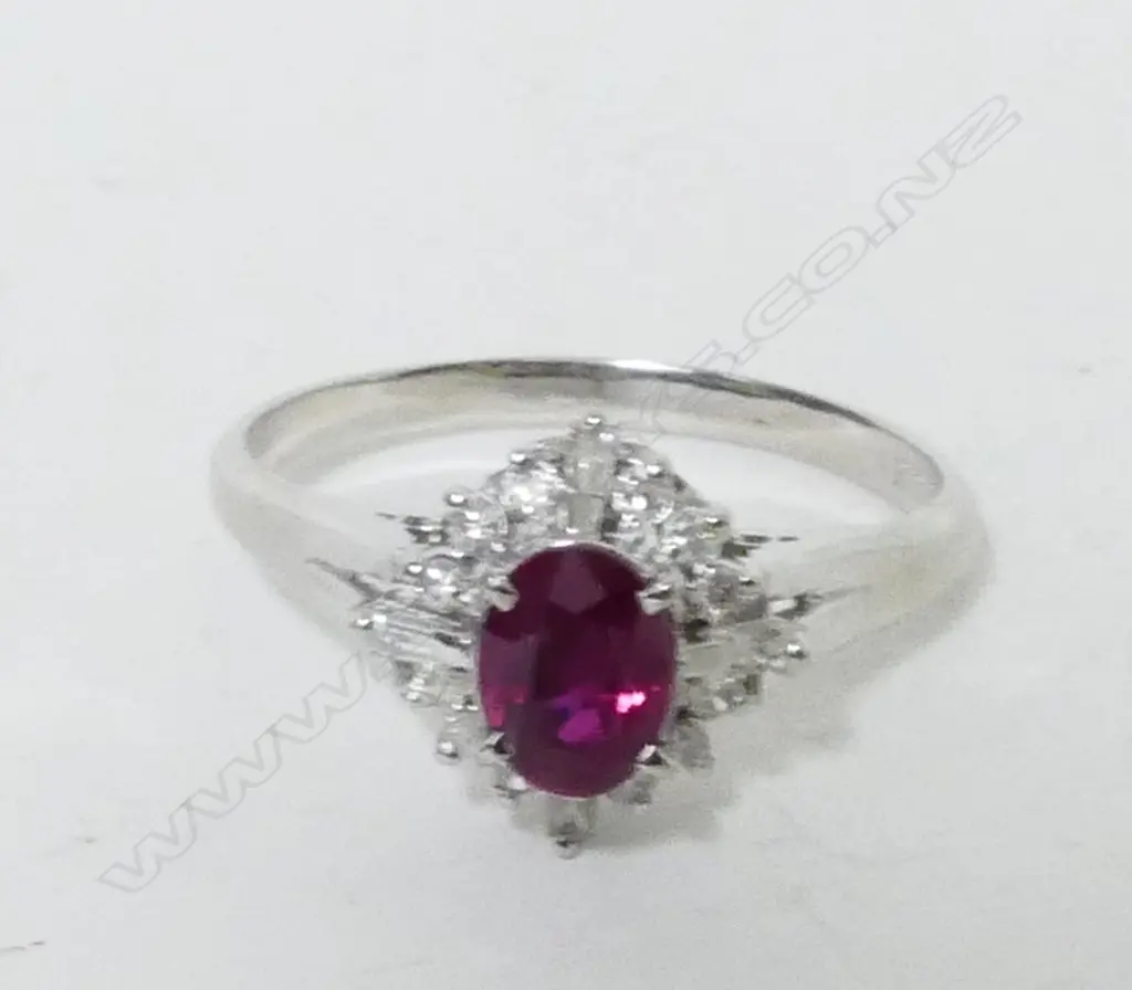 An 18ct. white gold ruby and diamond dress ring Image 1++