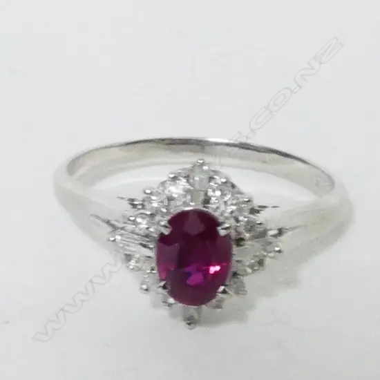 An 18ct. white gold ruby and diamond dress ring