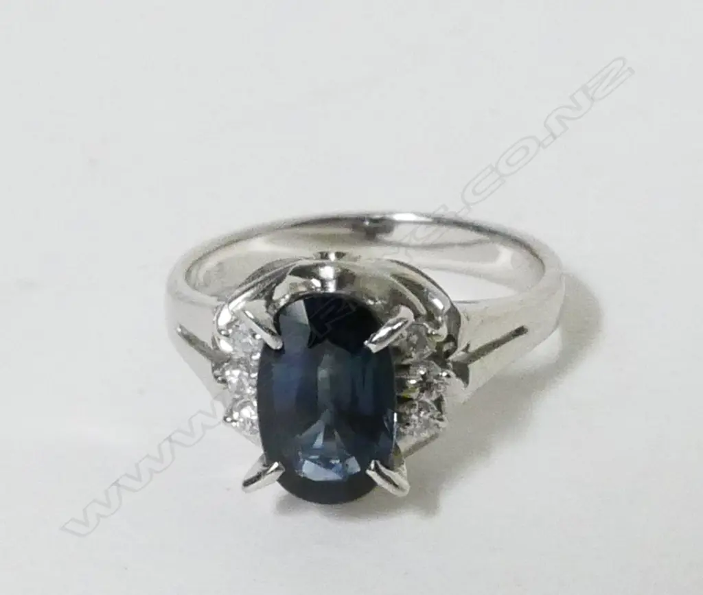 A platinum sapphire and diamond dress ring Image 1++