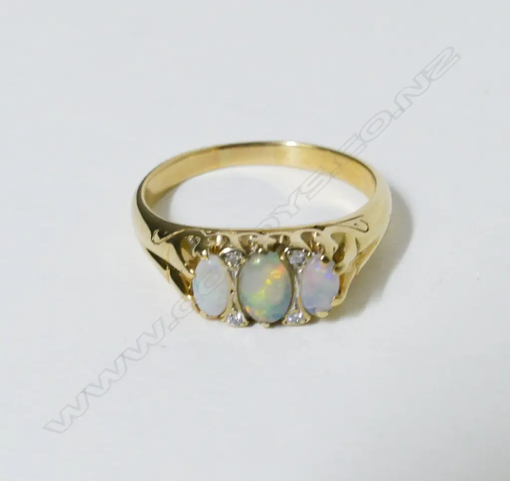 A 9ct. gold opal and diamond ring Image 1++