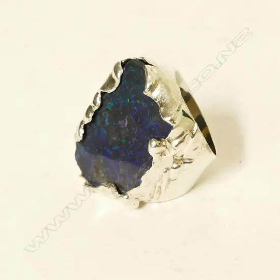 A large silver and opal ring