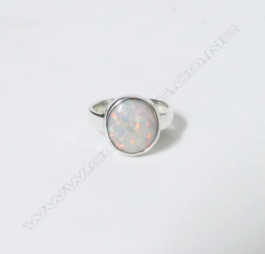 A silver and opal ring Image 1++