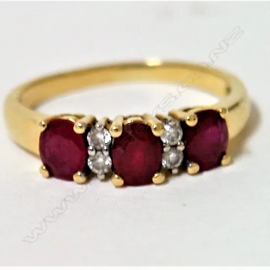 An estate 18ct. yellow gold ruby and diamond bridge ring