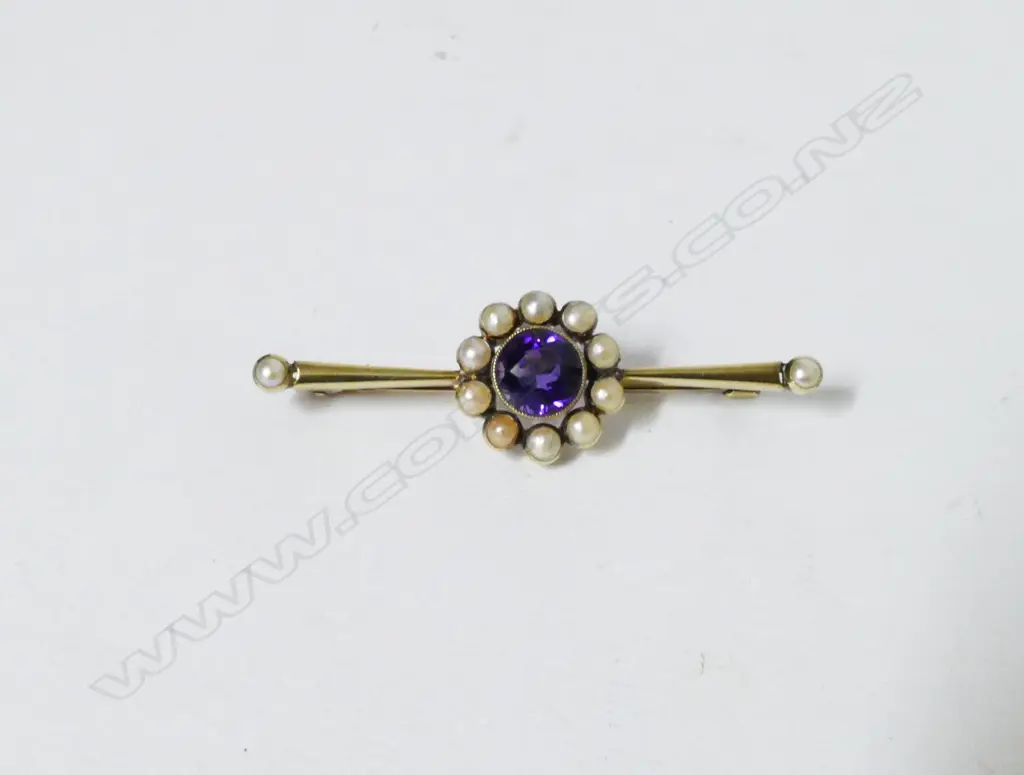 An antique 15ct. gold amethyst and pearl bar brooch Image 1++