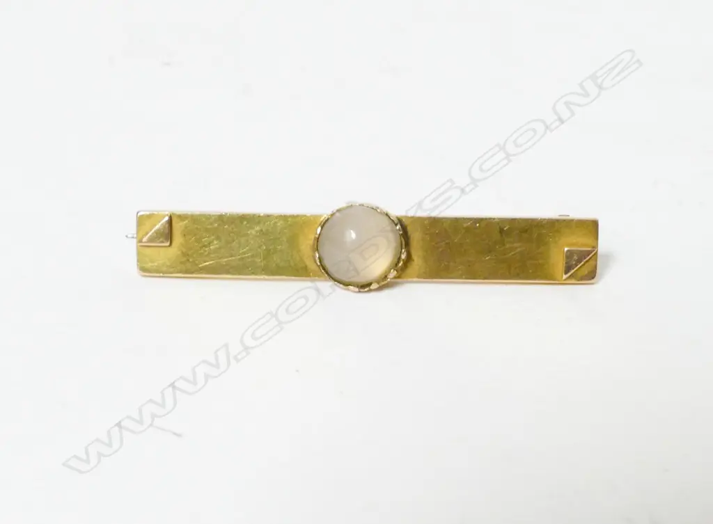 A Colonial 15ct. gold and moonstone bar brooch Image 1++