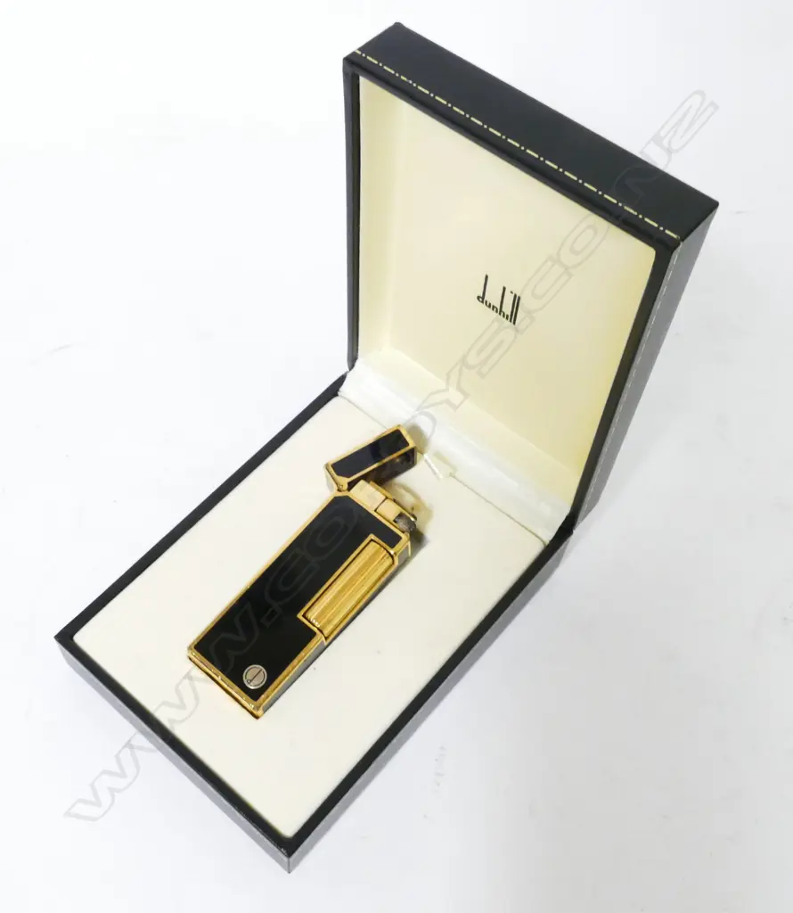 A black enamel and gold metal Dunhill lighter Image 1++
