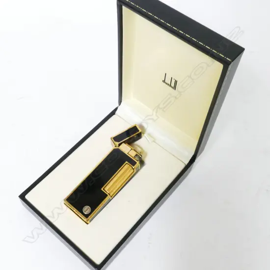 A black enamel and gold metal Dunhill lighter