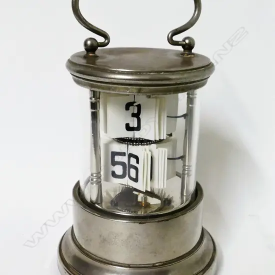 A rare silver plated ticket clock