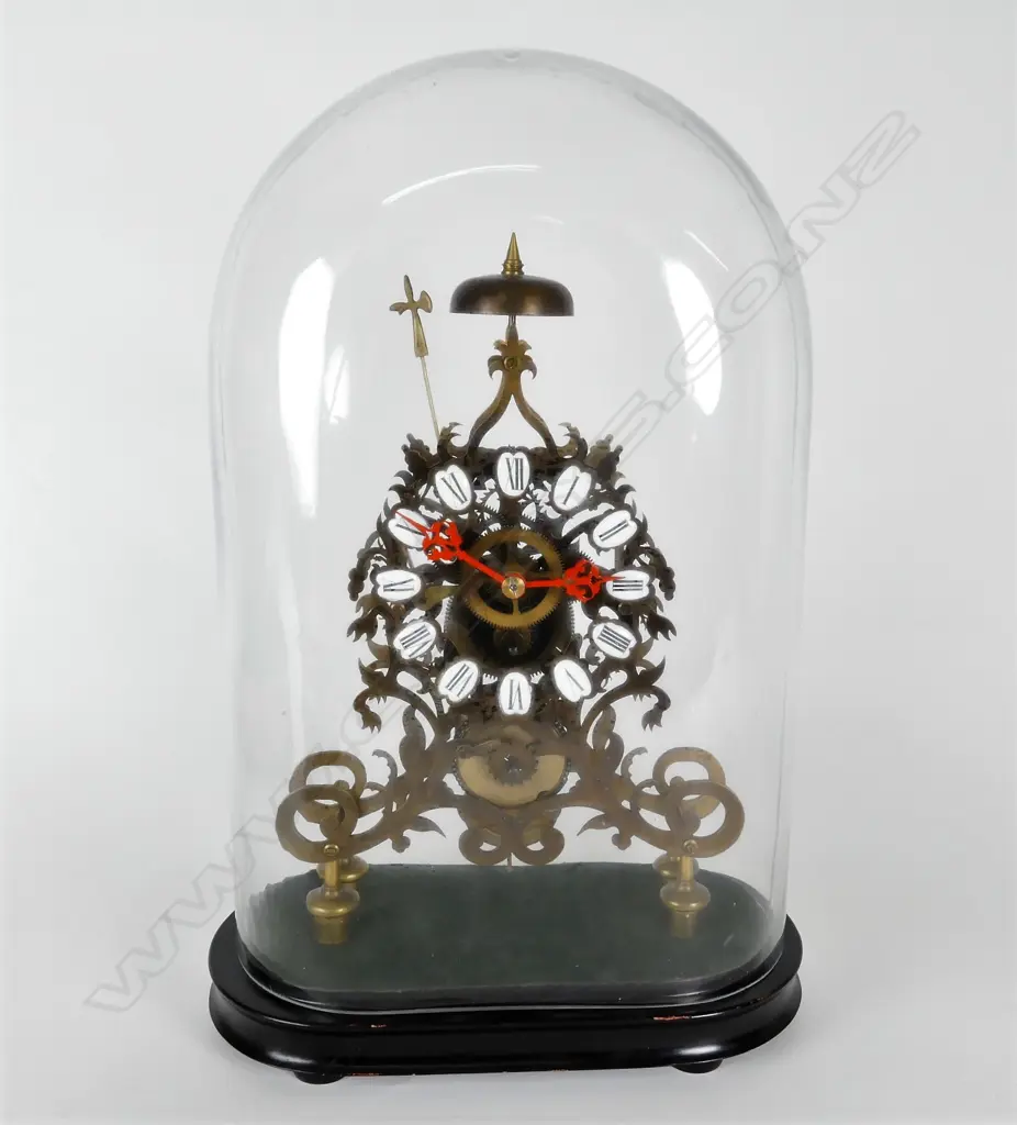 A brass skeleton clock Image 1++