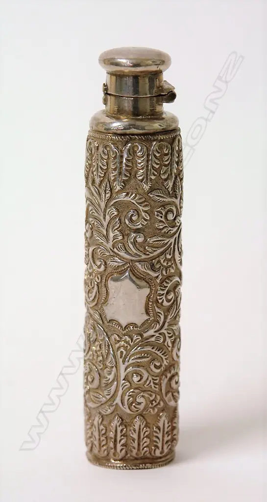 An early 20thC silver embossed tall cylindrical scent bottle Image 1++