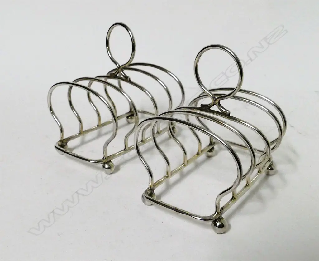 A pair of small silver toast racks Image 1++