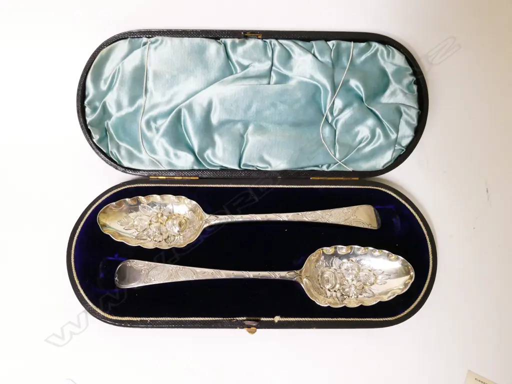 A cased pair of silver bottom marked berry spoons Image 1++