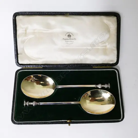 A cased pair of silver seal top spoons