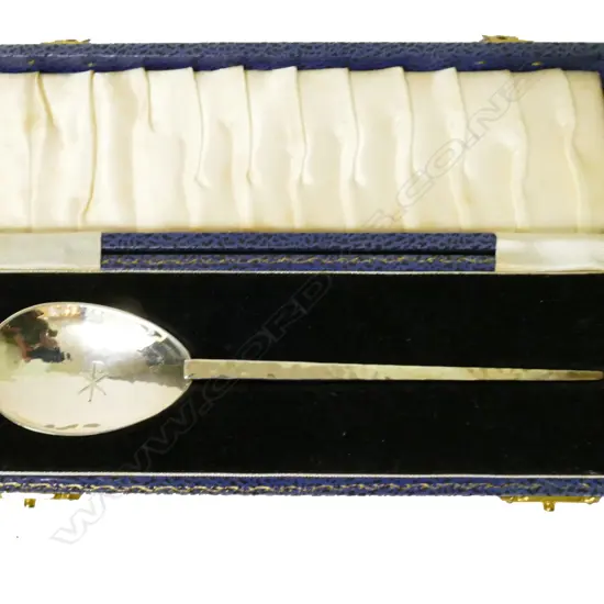 A silver anointing spoon